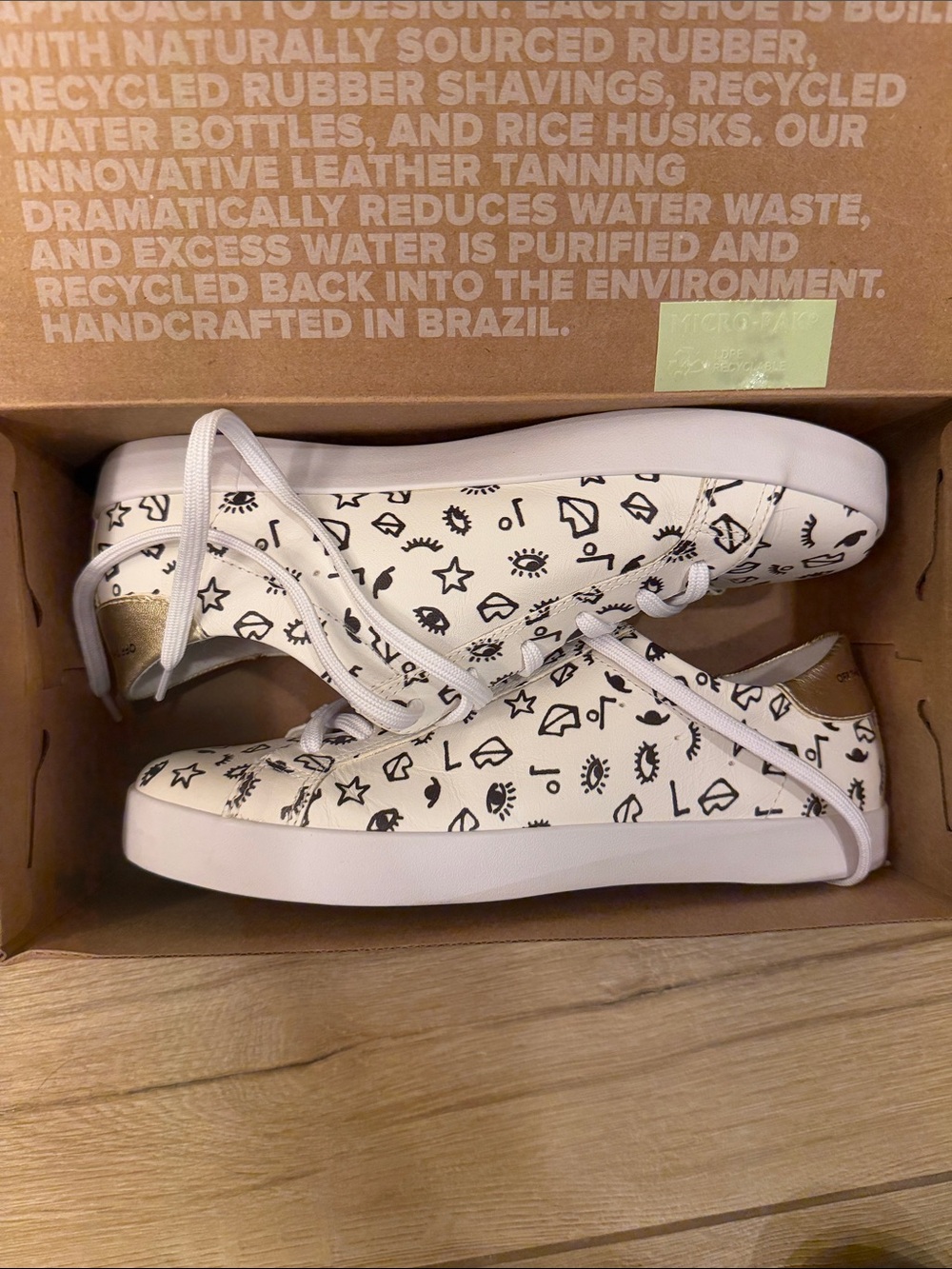 OTBT White Low-Top Sneakers with Black Graphic Print and Gold Heel Tab
